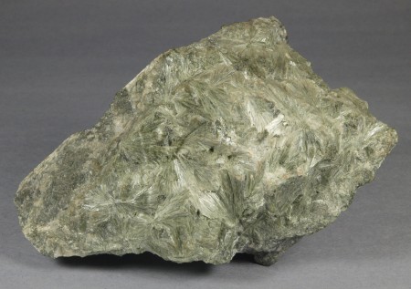 Actinolite in intergrown plumose masses of fibrous to acicular, pale grayish green crystals