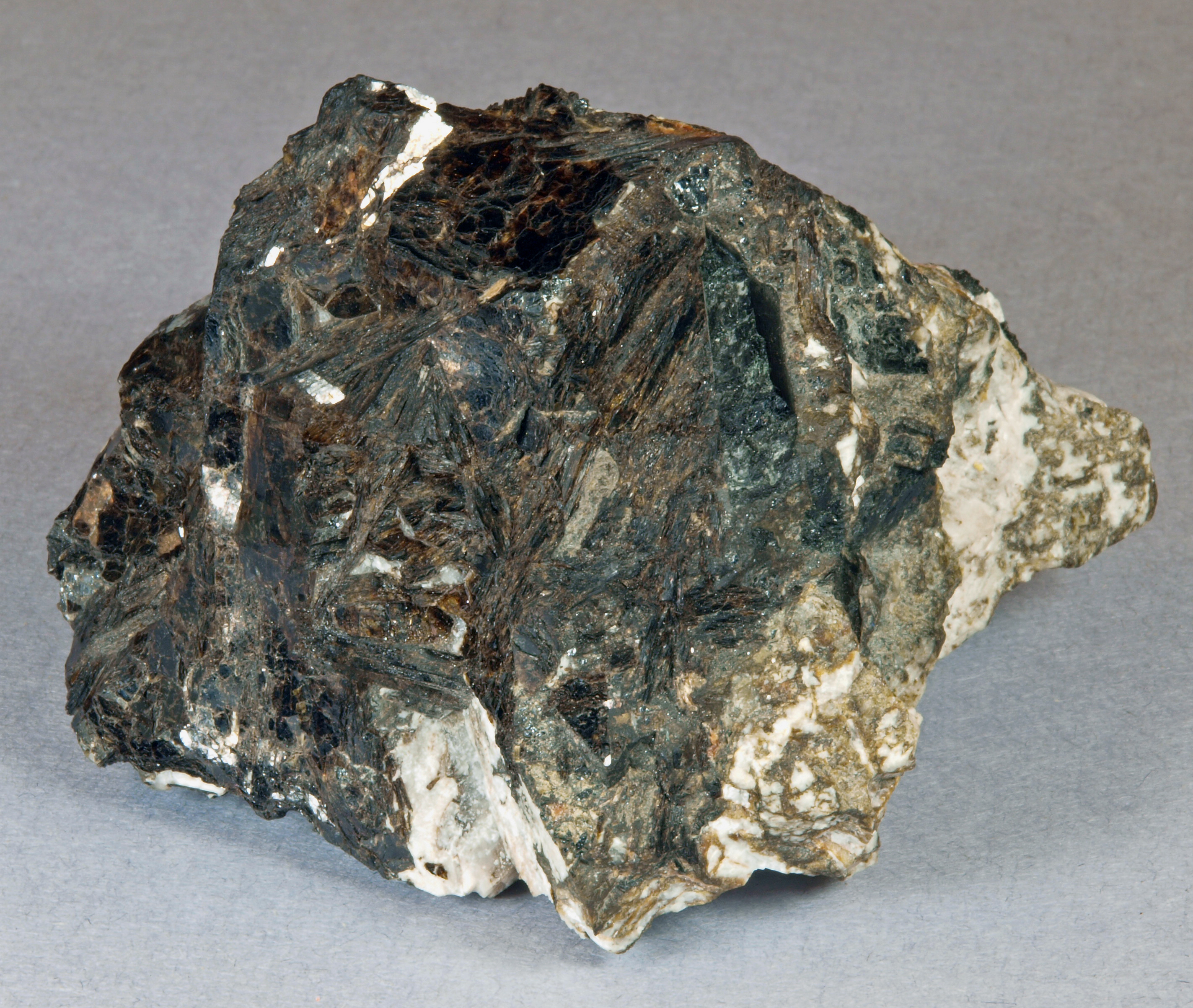 Bannisterite in broad, intergrown, tabular, dark brown crystals of micaceous habit