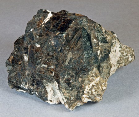 Bannisterite in broad, intergrown, tabular, dark brown crystals of micaceous habit
