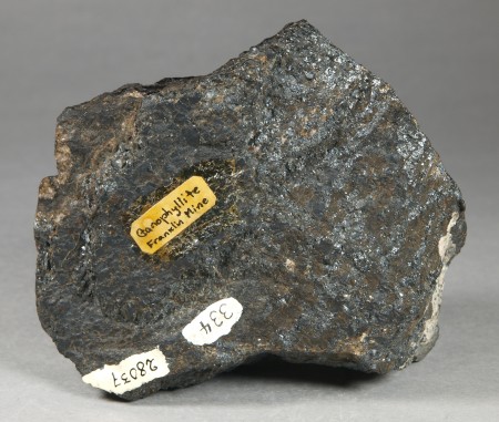 Large, dark brown, intergrown, platy grains of bannisterite