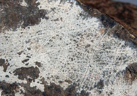 Coating of dypingite, franklinite-calcite ore, Sterling mine, Ogdensburg