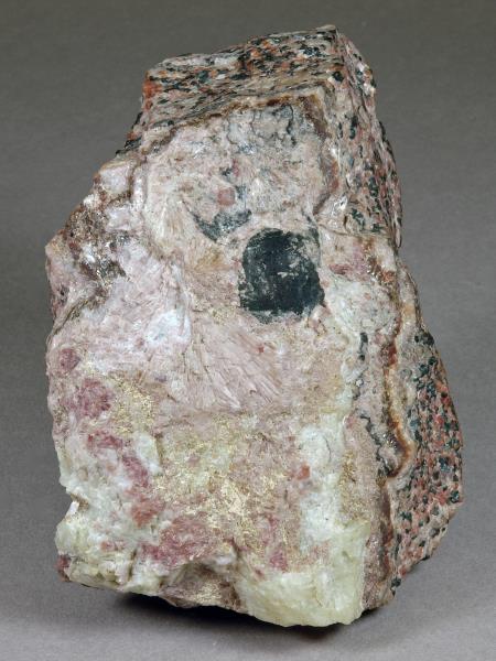 Radiating pale pink gerstmannite crystals on pale green willemite,white calcite and black pyrochroite