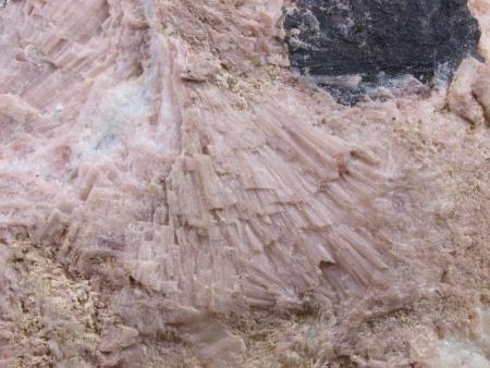 Radiating pale pink gerstmannite crystals on pale green willemite,white calcite and black pyrochroite
