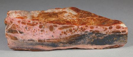 SCH1, reddish-brown schallerite blebs in a matrix of fine-grained pink rhodonite, Franklin mine, Franklin NJ