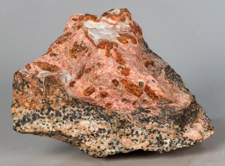 SCH4, brown schallerite, rhodonite, white barite, white calcite on franklinite-willemite-calcite ore, Franklin mine, Franklin NJ