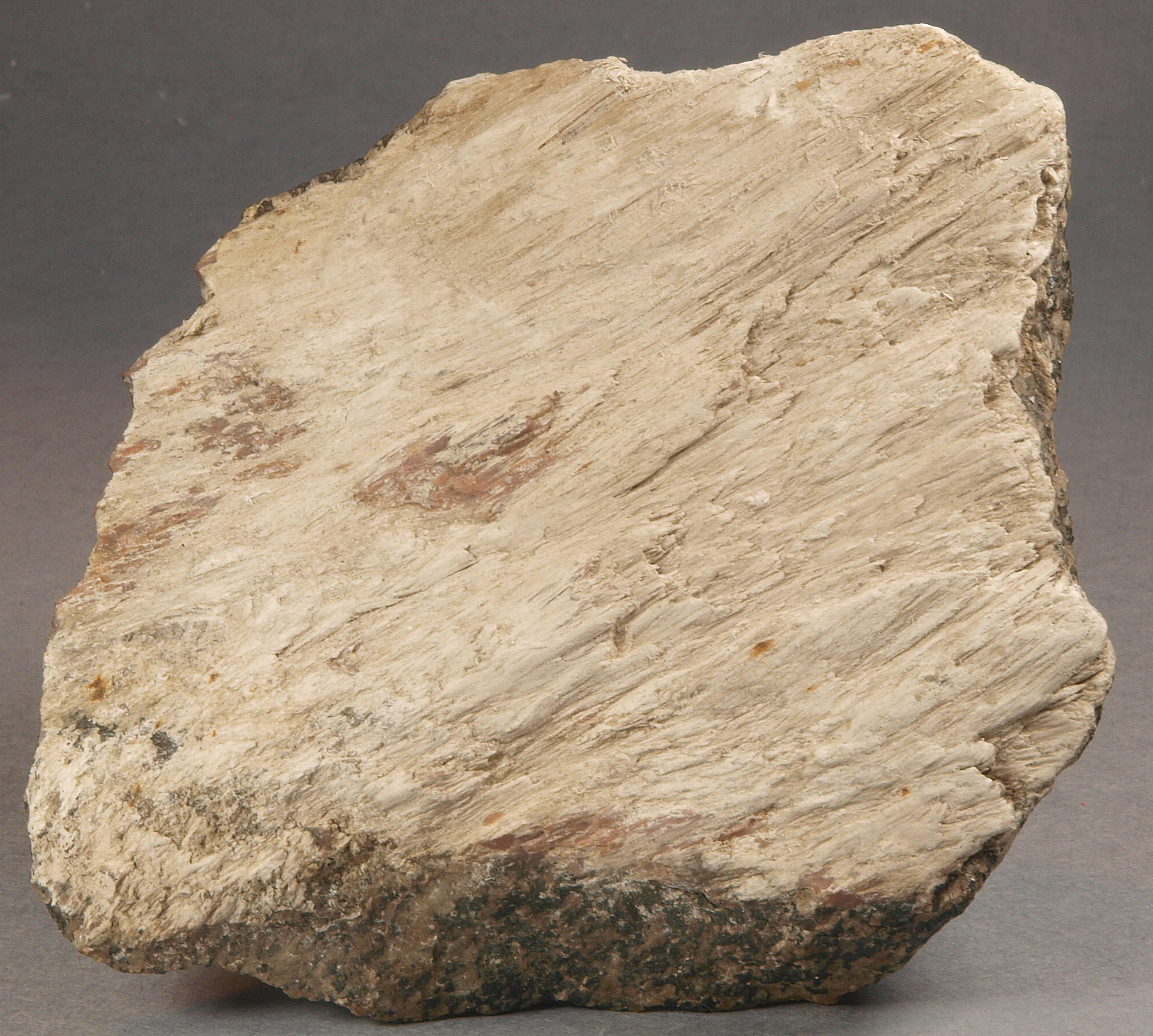 White to cream-colored fibrous sussexite, franklinite and pale green willemite, Franklin mine, Franklin