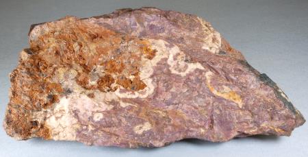 Purplish sussexite, brownish orange zincite, white calcite, Sterling mine, Ogdensburg