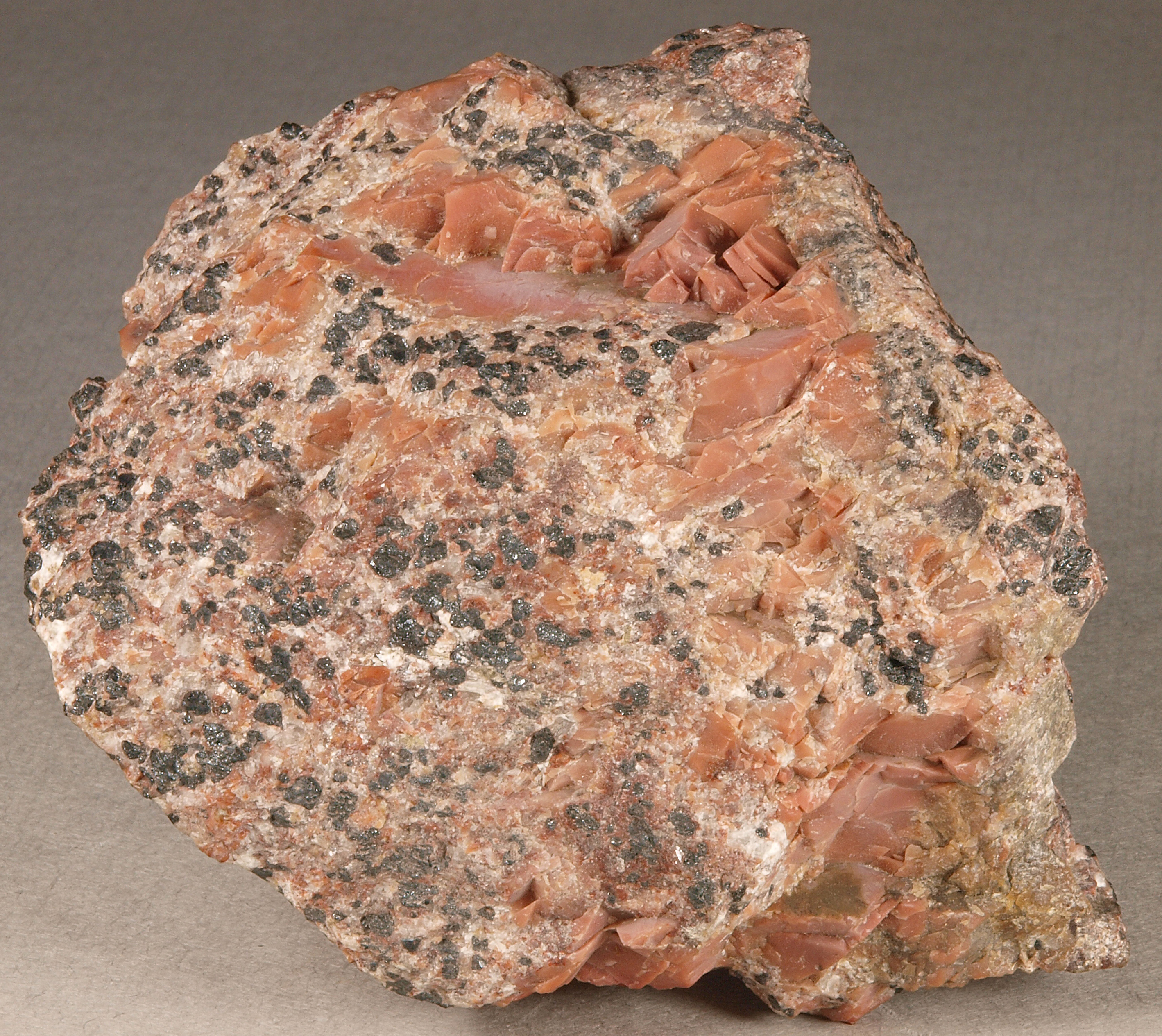 Cherty salmon-colored sussexite in lean franklinite-willemite-calcite ore, Sterling mine, Ogdensburg