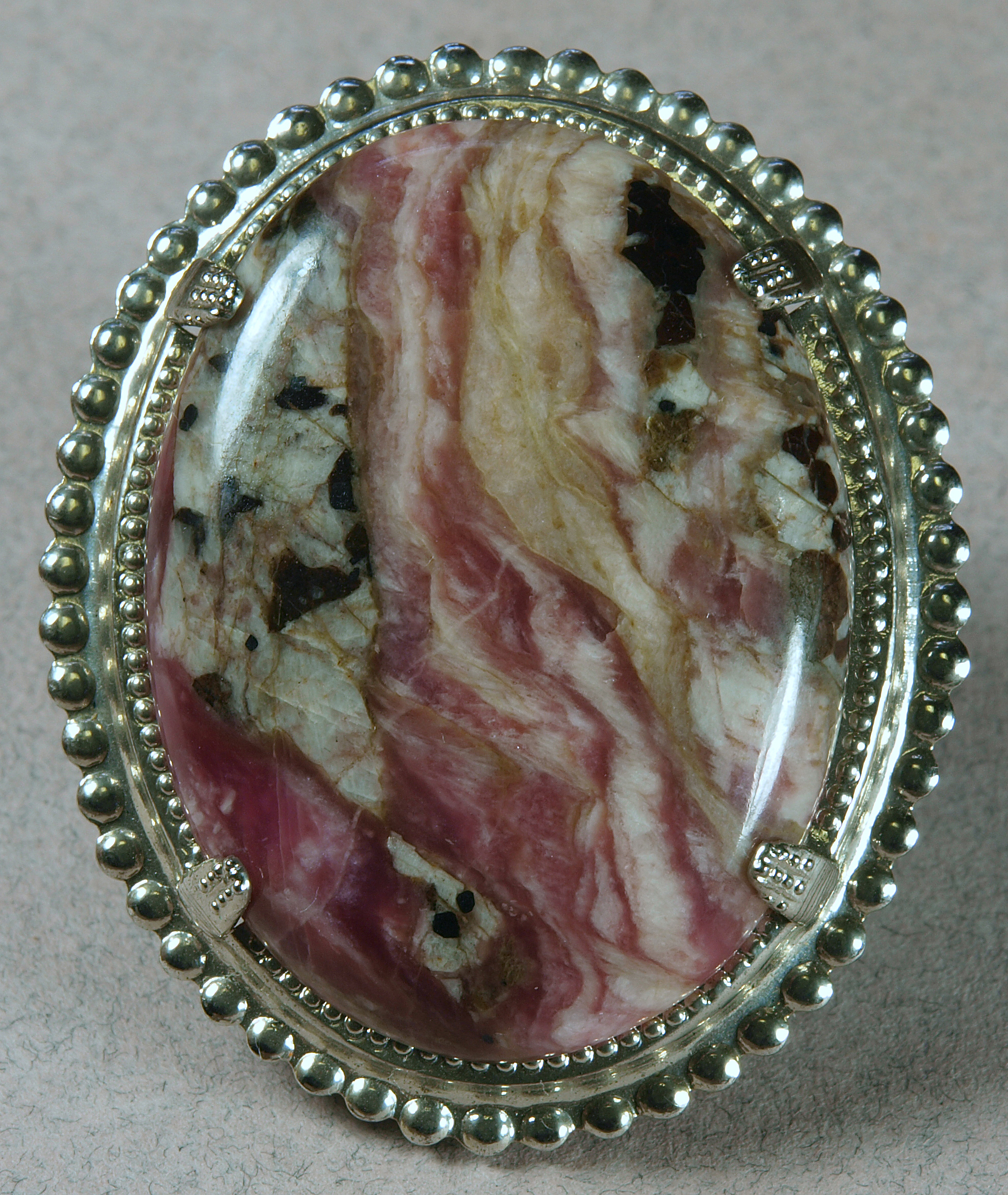 Deep pink sussexite cabochon, wth franklinite-calcite ore, Sterling mine, Ogdensburg