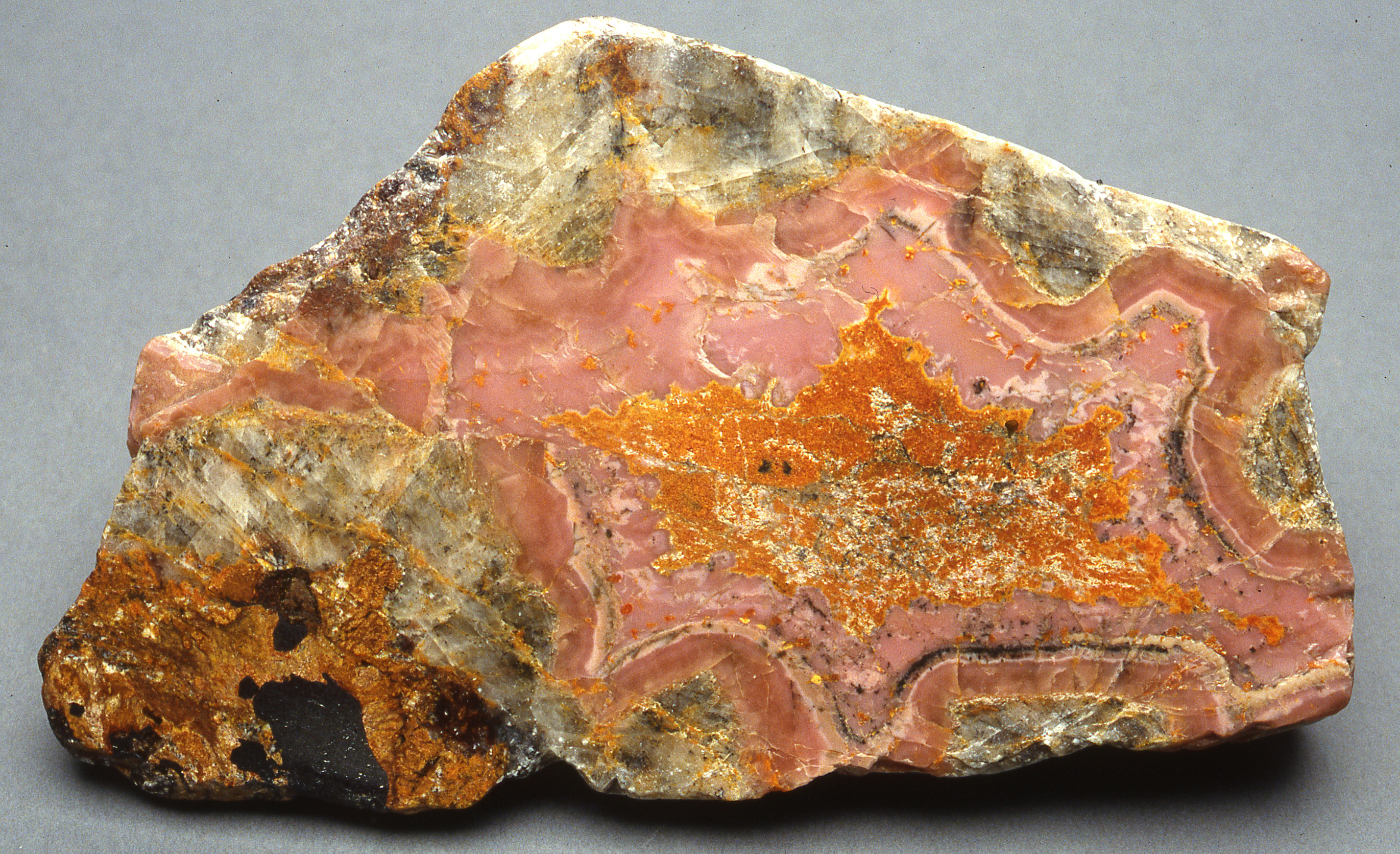 Sussexite, orange secondary zincite, calcite, Sterling mine, Ogdensburg