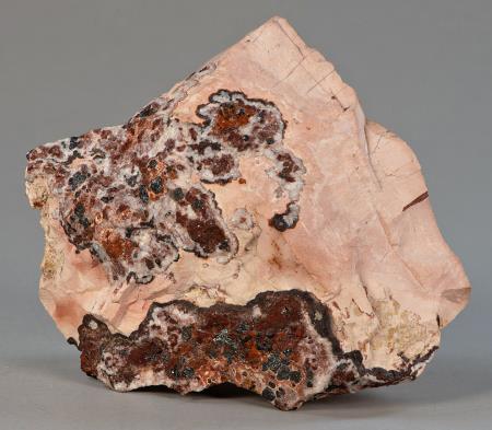 Pale pink sussexite, hematite-strained ore, calcite, Sterling mine, Ogdensburg