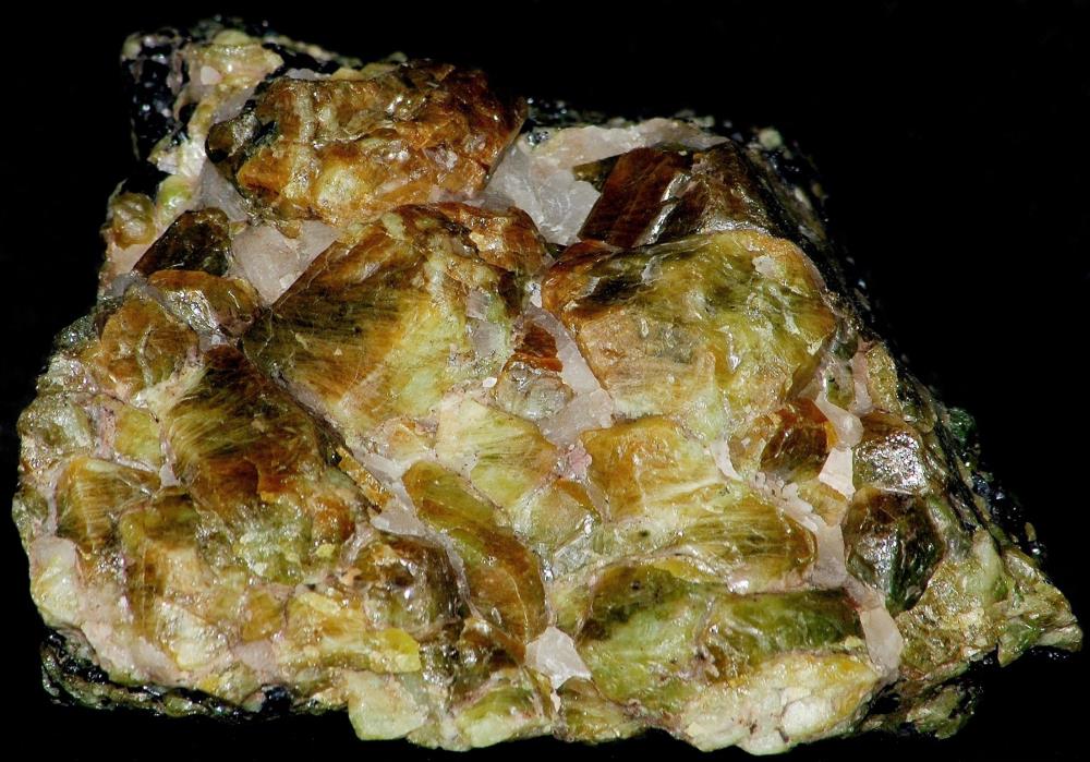 Root beer and honey green willemite crystals with calcite and franklinite from Franklin, NJ.