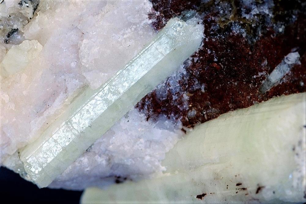 Clear mint geen willemite crystal on calcite, hematite