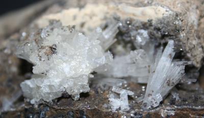 Aragonite crystals on matrix, "mud zone," from Sterling Hill Mine
