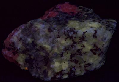 Barite, hyalophane, calcite, and andradite from Franklin, NJ under midwave UV Light