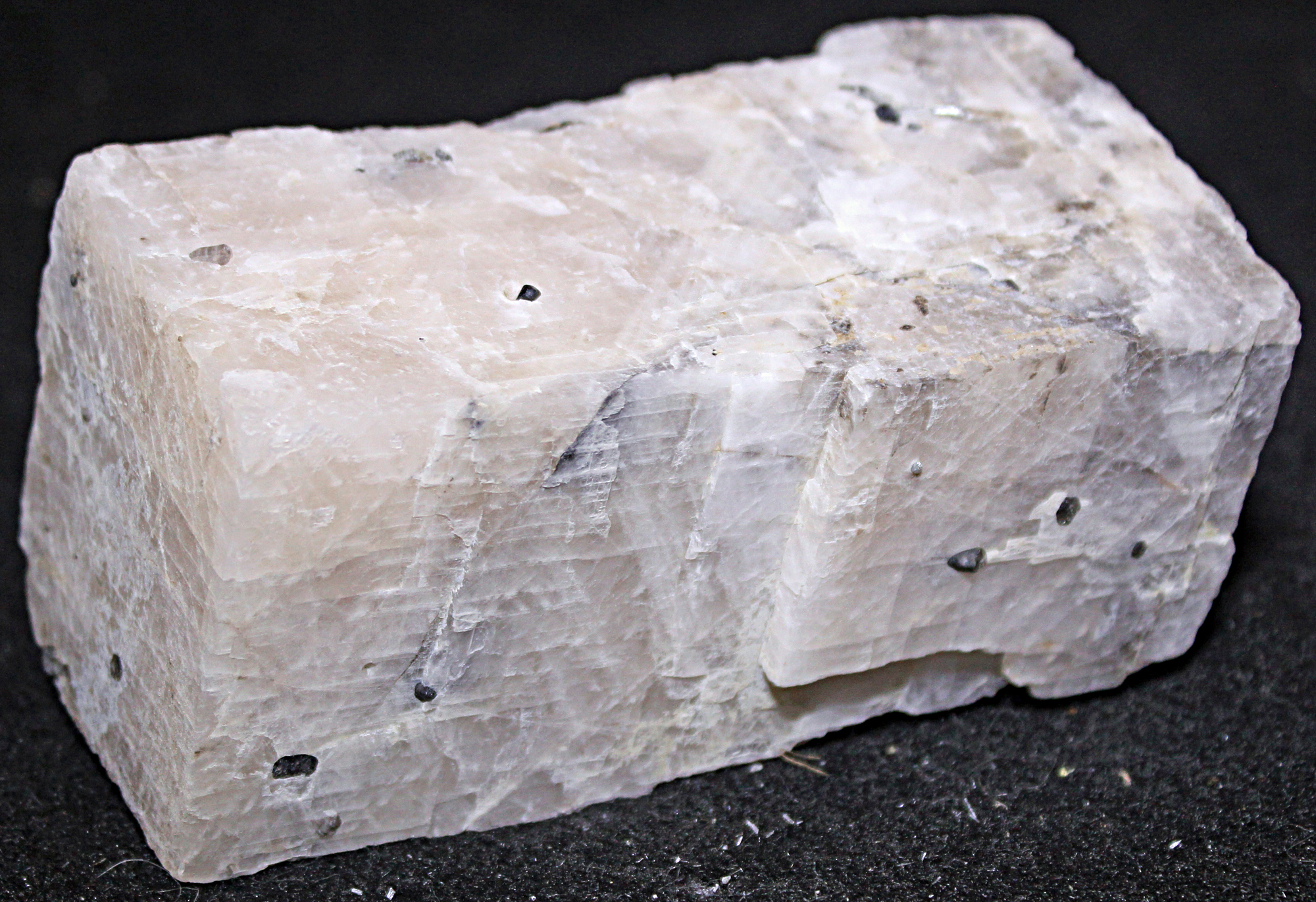 White calcite rectangular prism with inclusions of black willemite Franklin