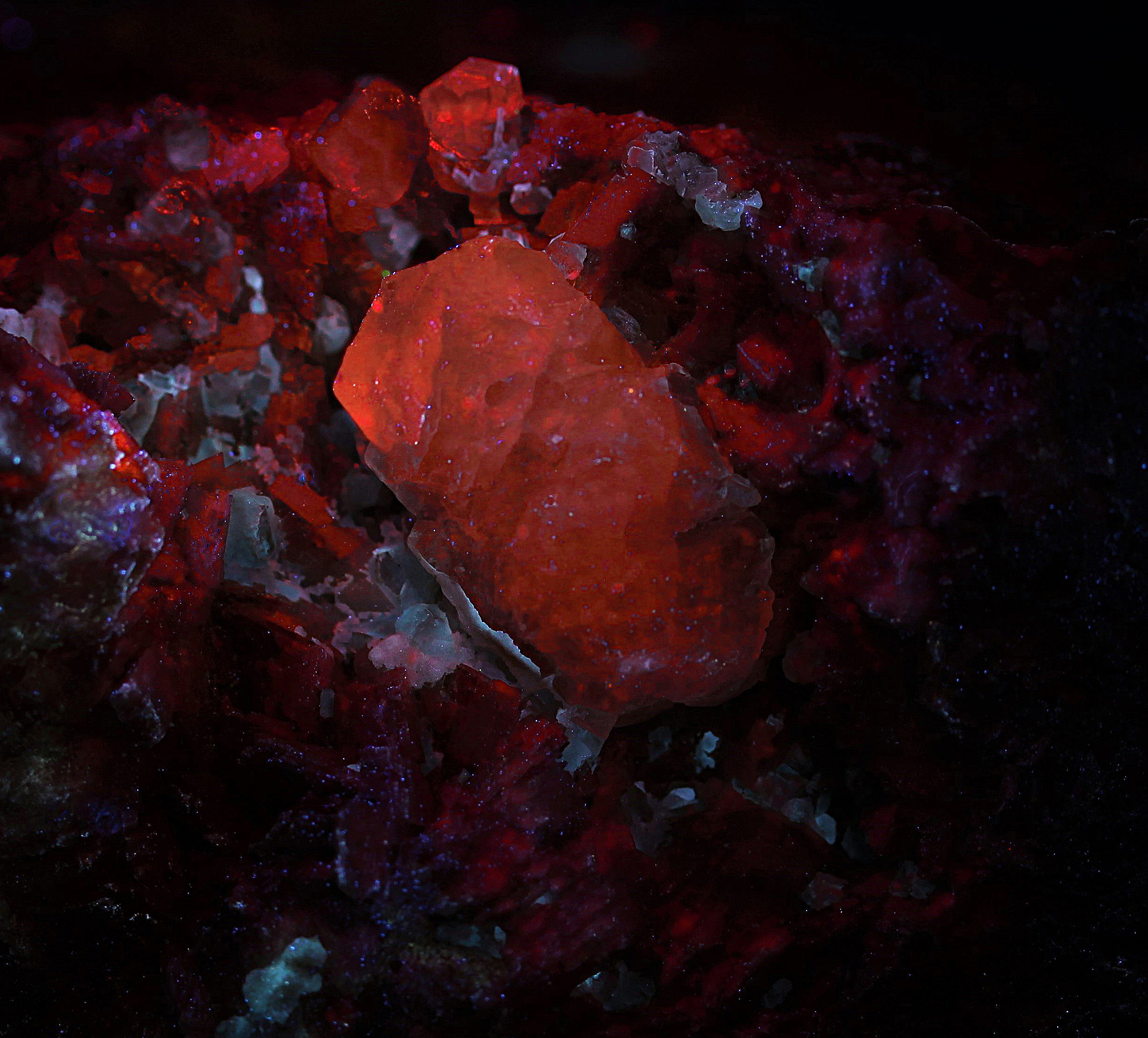 Calcite crystals, dolomite with carbonate coating from the Lang Shaft, Franklin, NJ  under longwave UV Light