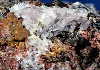Amethystine clinohedrite crystals, hancockite, andradite, hendricksite, minor willemite, from Franklin, NJ