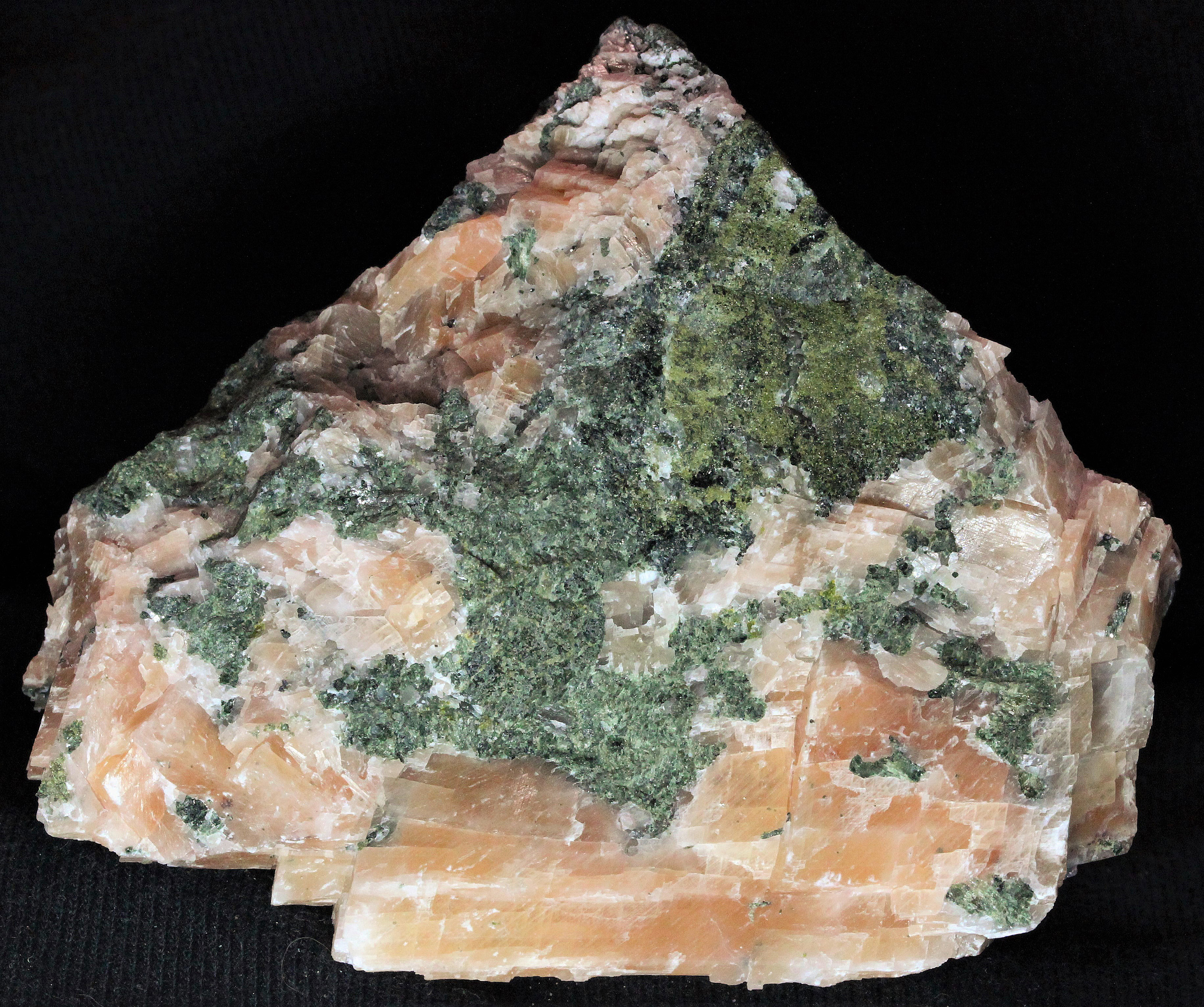 Epidote and salmon calcite from the Mill Site, Franklin, NJ. Photo by WP.