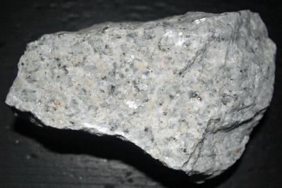 Fluoborite grains in calcite / marble, with graphite and pyrite, Sterling Hill Mine