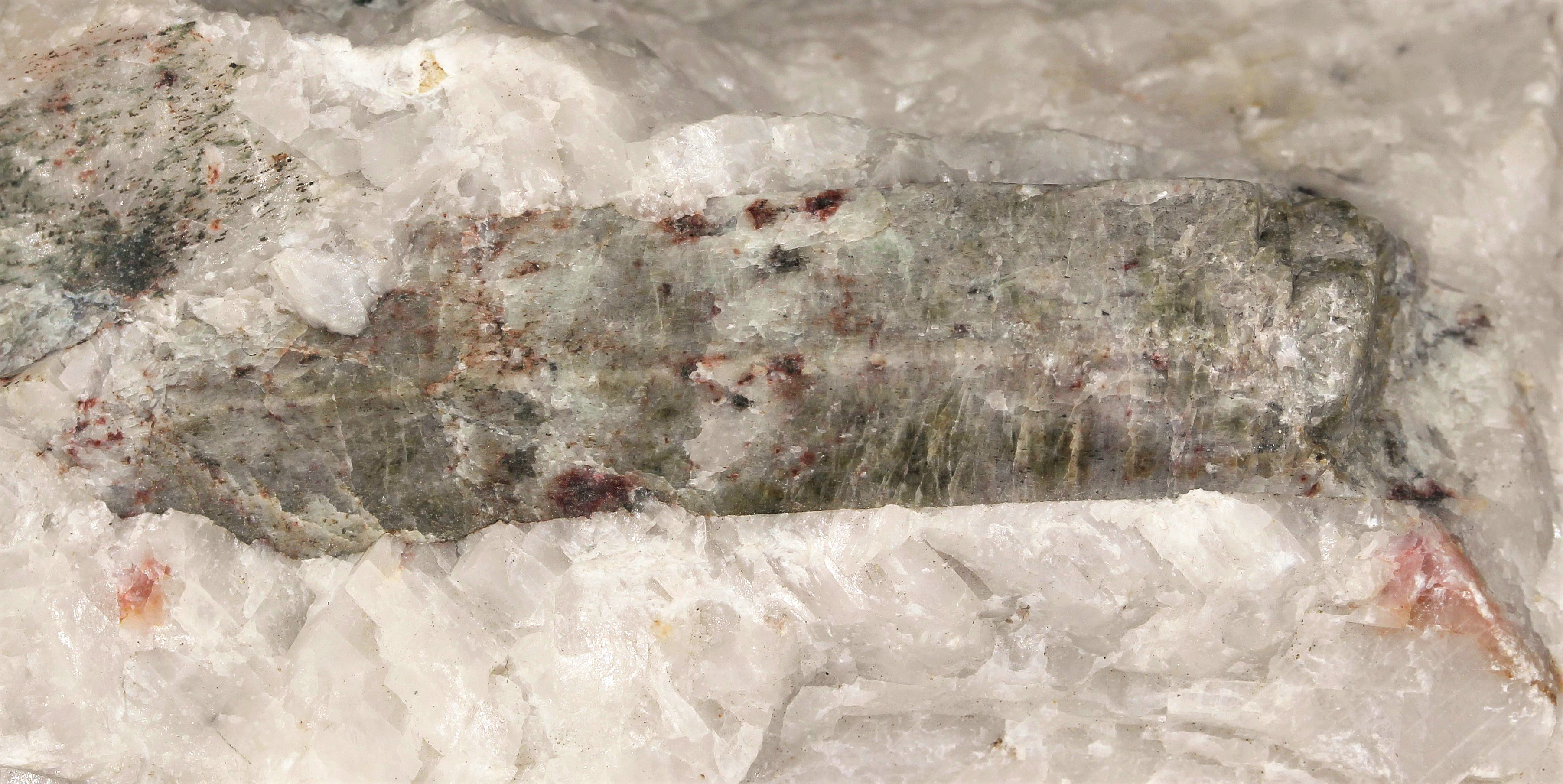 Fluorapatite crystal on calcite from the Sterling Hill Mine, NJ