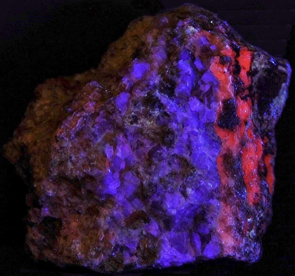 Fluorite, calcite, garnet from Franklin, NJ. under longwave UV Light