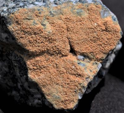 Friedelite crystals on calcite, franklinite matrix from Sterling Hill Mine, Ogdensburg, NJ