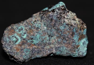 Malachite, calcite, feldspar, franklinite and biotite mica from Sterling Hill Mine, NJ.