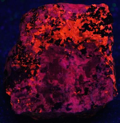 Meionite, calcite, franklinite and galena from Sterling Hill Mine, NJ. under shortwave UV Light