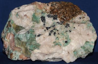 Microcline var amazonite, calcite, salmon calcite, franklinite and garnet from Franklin, NJ
