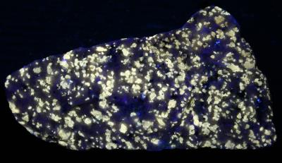 Norbergite from Braen Stone Industries' Franklin Quarry under shortwave UV Light