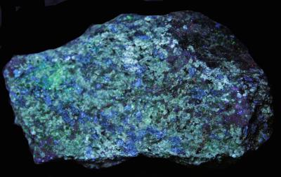 Pargasite (FL blue-green), diopside, supposedly from Sterling Hill Mine under shortwave UV Light