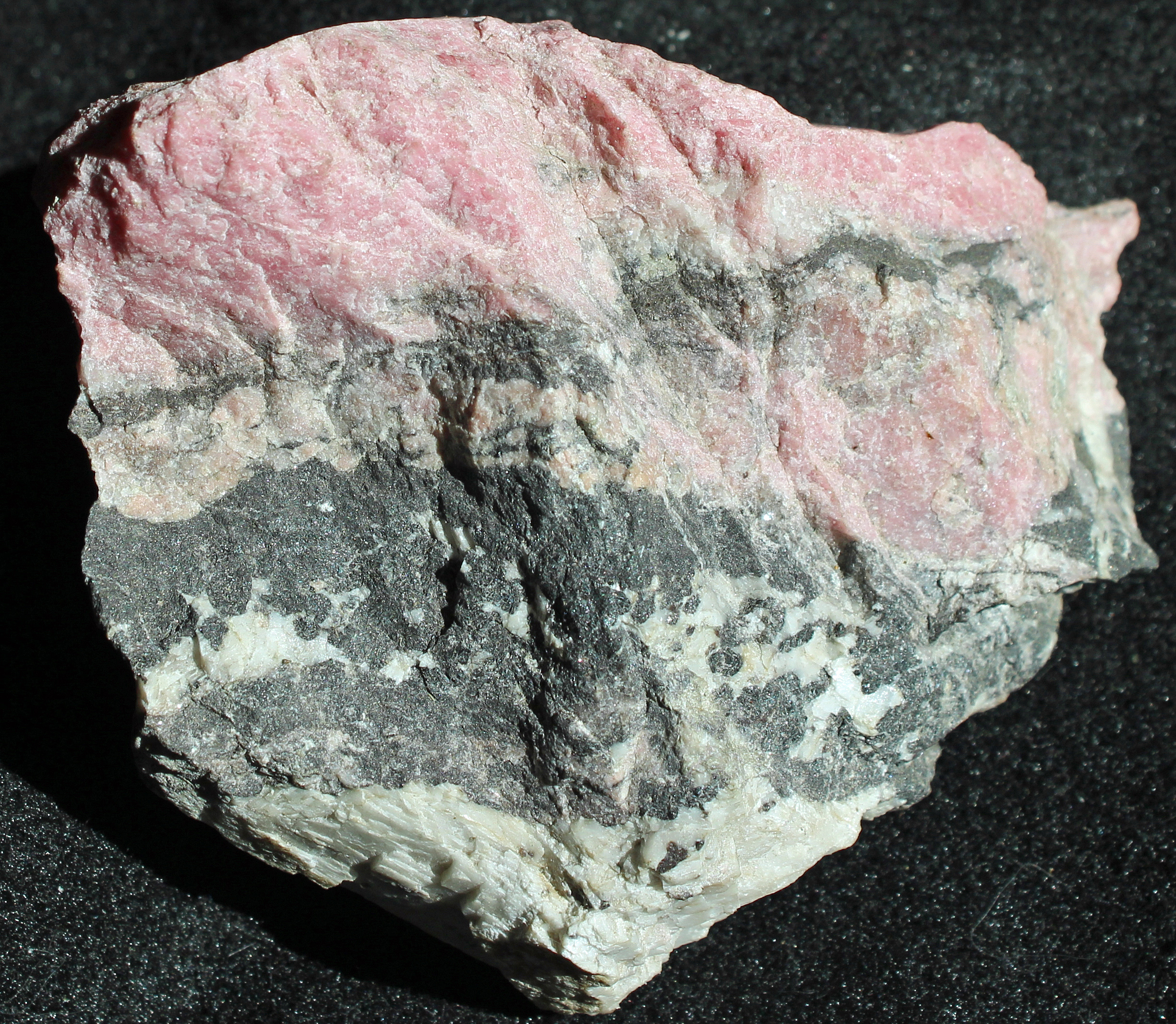 Rhodonite and calcite in matrix, from the Sterling Hill Mine, NJ