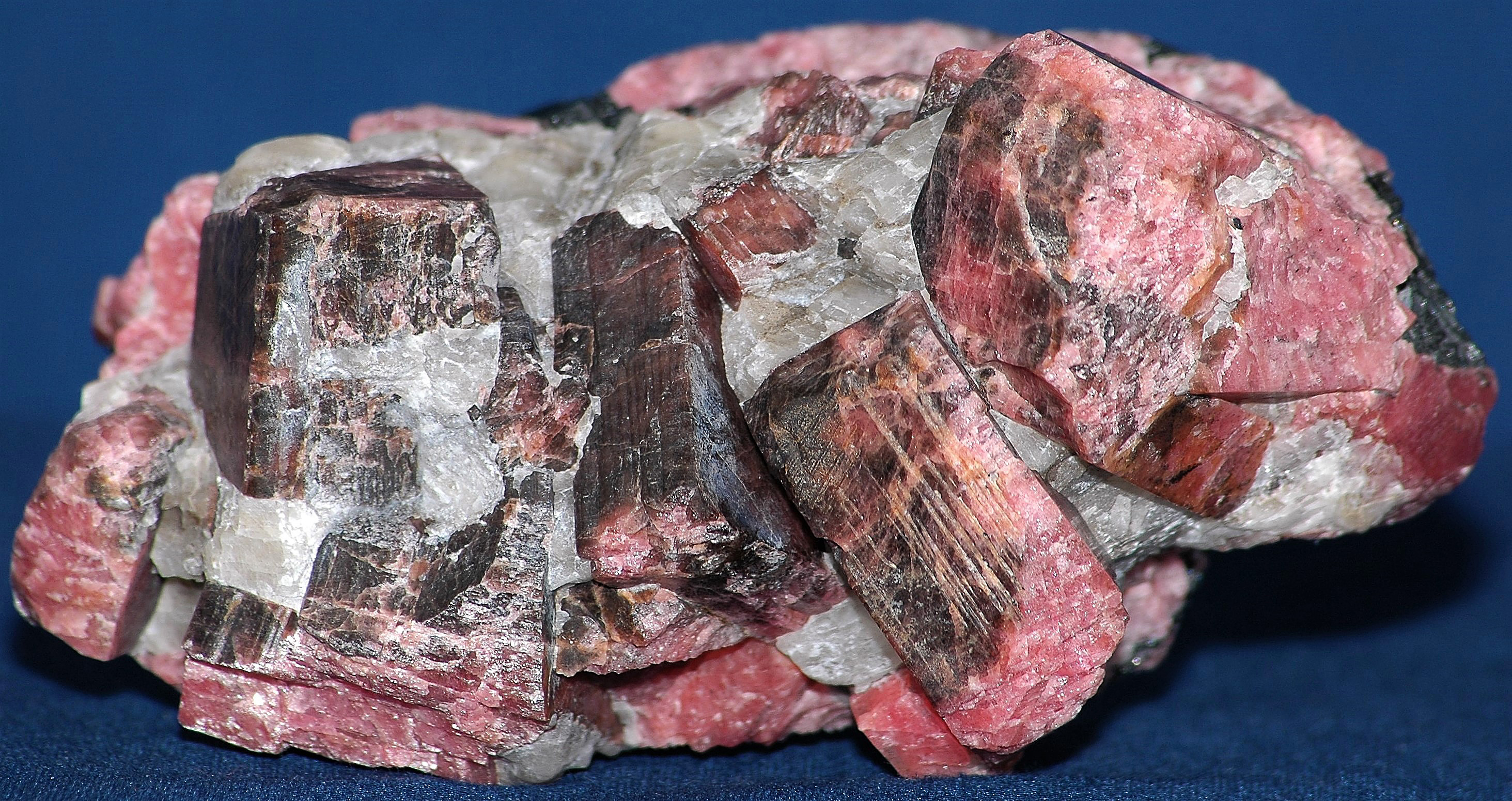 Corrugated rhodonite crystals, calcite and minor franklinite from Franklin, NJ