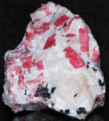 Rhodonite crystals, calcite and minor franklinite from Franklin, NJ