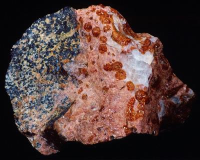 Schallerite (sperules), rhodonite, calcite, willemite and franklinite from Franklin, NJ