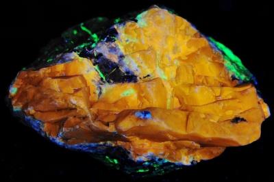 Sphalerite, willemite, franklinite and minor calcite, from Franklin, NJ. under longwave UV Light
