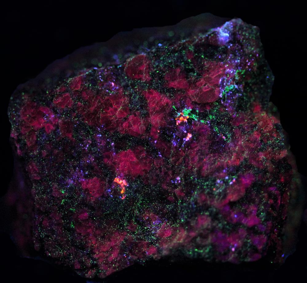 Sphalerite, microcline feldspar, minor willemite from the Buckwheat dump Franklin, NJ under shortwave UV Light