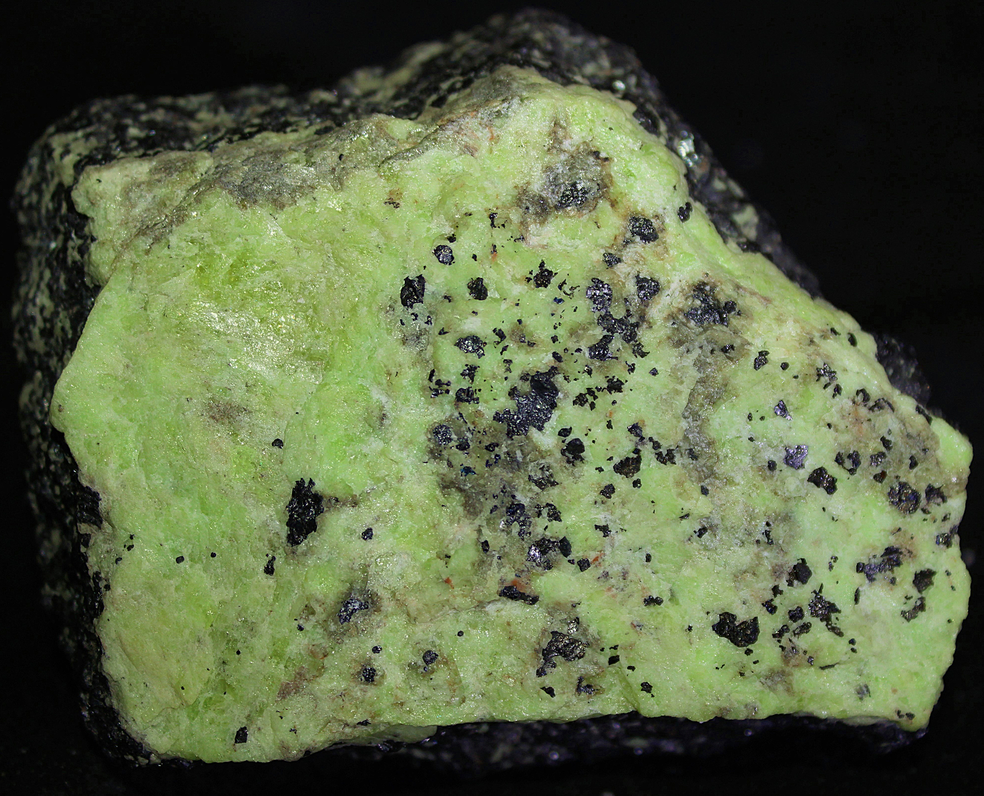 Green willemite, glaucochroite and franklinite, from Franklin, NJ.