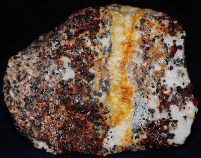 Zincite, secondary zincite, franklinite, calcite, willemite, minor hydrozincite from Sterling Hill, NJ